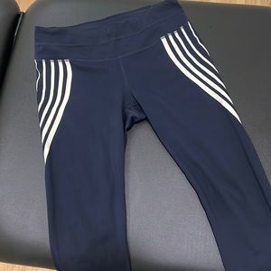 Athleta size M leggings navy with white curved stripes